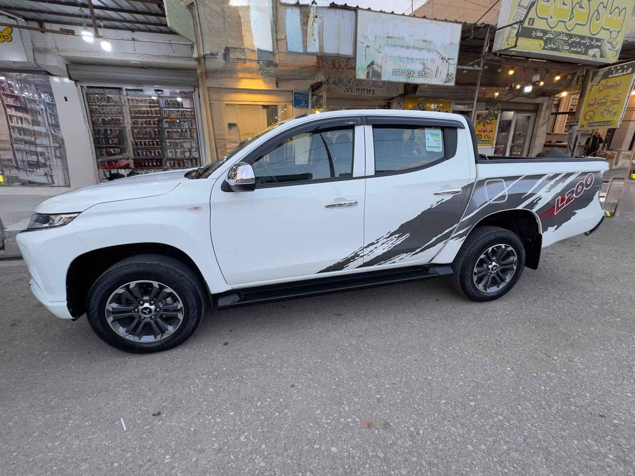 L200 2023للبيع
� للبيع ميتسوبيشي L200 موديل 2023 🚘

السيارة نظيفة جدًا
استخدام شخصي
كفالة عامة 
جاهزة للفحص

🔧 المواصفات:
• الموديل: 2023
• الشركة: Mitsubishi
• الطراز: L200
• دبل دفع رباعي 4×4
• ناقل الحركة: يدوي
• الوقود: بنزين
• الممشى: 27,000 كم
• اللون: أبيض
• محرك 2500cc
• صرفية ممتازة
• تكييف ممتاز
• داخلية نظيفة جدًا
💰 السعر: 225 ورقة و بي  مع مجال 
📍 الموقع: (كركوك)
📞 الاتصال: (***********)
