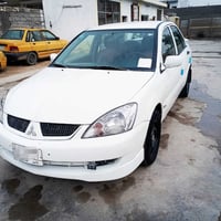 ميتسوبيشي لانسر • اوتوماتيك • ضرر خلفي