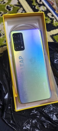 جهاز ريلمي Q3 كامل ملحقات ذاكرة 128 جهاز مكفول عده الفطر البضهر الصغير...