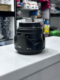 عدسه 50mm كانون سكما  نضيفه جدا كامله فتحه 1.4  العنوان : بغداد باب ال...