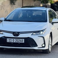 كورلا 2025 فول  فتحه وبصمه  كشنات جلد  هايبرد وبانزين ماشيه 14 الف الر...