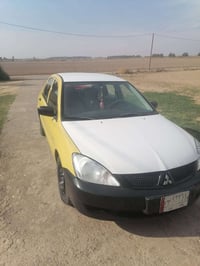 لانسر للبيع مطلوبه موديل 2010 07767326594