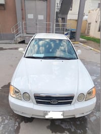 كيا اوبتيما 2006 وارد امريكي محرك 2400  كير محرك كهربائيات جيدة جداً ا...