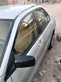 لانسر ٢٠٠٧ سياره جاهزه تخم تاير رقم انكليزي تبريد شغال السعر 40 رقم ال...