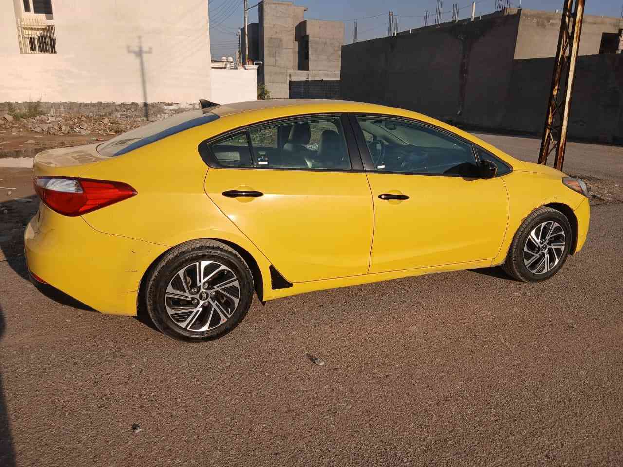 السلام عليكم كيا فورتي اصفر اللون (اجره) رقم بغداد بـ اسمي شرط التحويل حادثها بـ امريكا فقط جامرلغ امامي عكس السايق بدون لــاا دواخل ولا ارباك شرط … موديل 2015 مصفره هيئه وغرامات  كير مكينه صدر كهربائيات كلها شغاله ومكفوله .. تخم تاير جديد بطاريه جديده .. نص مواصفات مكاني ديالى بعقوبه ام الاعظام سعرها 115 وبيها مجال بسيط غير متواجد ع النت اتصل ع الرقم وادلل ‭0771 623 3550
