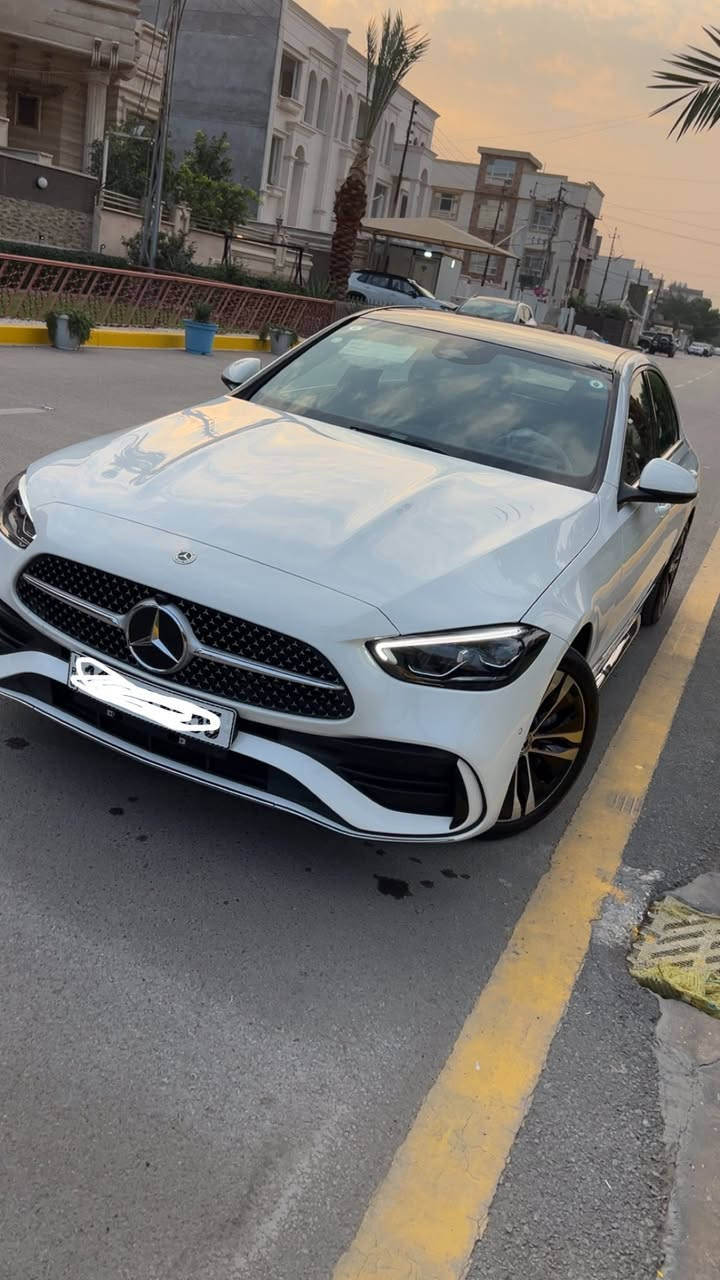 مرسيدس بنز  C350 EL 
موديل 2024
زيرووووو صفر 
رقم بغداد مميز
طراز هجين (Plug-in Hybrid) يجمع بين الأداء الرياضي والتكنولوجيا المتقدمة
ثلاث انظمة قيادة 
1️⃣ - بانزين 
2️⃣ - هايبرد 
3️⃣ - شحن كهربائي تمشيك 100 كيلو 
تختار النظام الي يعجبك 
السيارة فول الفول موصفات 

1- نظام القيادة الذاتية والمساعدة (ADAS) الرادار والكاميرات
2-  (DRIVE PILOT ) : يعتبر من أكثر أنظمة القيادة الذاتية من المستوى 3/4 تطوراً في العالم. في ظروف معينة (طرق سريعة مزدحمة)، يمكن للسائق تسليم القيادة الكاملة للسيارة وتشغيل قوانين أو مشاهدة فيلم.

3- نظام المساعدة على التوجيه الذكي (Active Steering Assist):** يحافظ على مسار السيارة في منتصف المسار، حتى في المنحنيات اللطيفة.

4- مساعد الحفاظ على المسار (Active Lane Keeping Assist): يكشف علامات المسارات ويتدخل بتوجيه عكسي لطيف إذا بدأت السيارة في الخروج عن المسار دون استخدام الإشارة.

5- مكابح الطوارئ الذكية مع (Active Emergency Stop Assist): تكشف المشاة والدراجات والسيارات، وإذا لم يستجب السائق، توقف السيارة تلقائيًا.

6- مساعد التكيف مع السرعة (Active Distance Assist DISTRONIC): تحكم تكيفي في السرعة يحافظ على مسافة آمنة عن السيارة التي أمامك، حتى في الزحام، ويتوقف ويعيد التحرك تلقائيًا.

7- مساعد تغيير المسار (Active Lane Change Assist): بمجرد تشغيل إشارة الاتجاه، تتأكد السيارة من أن المسار خالٍ وتنفذ تغيير المسار بسلاسة.

8- نظام التحذير من الاصطدام الأمامي (Front Collision Warning)

9- مساعد الخروج من المرآب الذكي (Remote Parking Assist): يمكن للسيارة أن تدخل أو تخرج من مكان ضيق (مرآب أو موقف) عن بُعد باستخدام تطبيق الهاتف الذكي، بدون وجود السائق داخلها.

10- رادار بعيد المدى (Long-Range Radar): للمسافات الطويلة على الطرق السريعة.

11- رادارات قصيرة المدى (Short-Range Radars): في الزوايا الأربع للسيارة للكشف عن العوائق أثناء المناورة وتغيير المسار.

12- أجهزة استشعار أولتراسونيك (Ultrasonic Sensors): للمسافات القصيرة جدًا أثناء الركن.

13- الشاشة ( MBUX Hyperscreen ): لوحة قيادة رقمية كاملة بشاشة كبيرة الحجم وشاشة مركزية ضخمة 

14- نظام MBUX (Mercedes-Benz User Experience): نظام الوسائط المتعددة الأكثر ذكاءً، يتعرف على الكلام الطبيعي ("مرحبا مرسيدس، أشعر بالبرودة" أو "اضبط الإضاءة على اللون الأزرق").

15- مقاعد أمامية ذات تحكم كهربائي ذاكرة  وتهوية وتسخين 

16- التحكم بالمناخ الذكي من 4 مناطق (4-Zone THERMATIC): حيث يمكن لكل راكب ضبط درجة الحرارة والتدفئة والتهوية حسب رغبته.

17- الإضاءة البيئية AMBIENT LIGHTING:مع 64 لونًا لتختار منهم، وإعدادات إضاءة متحركة ومتعددة.

18- سقف بانورامي كهربائي (Panoramic Sliding Sunroof)

19- فتح وإغلاق وإقلاع السيارة بدون مفتاح (Keyless-Go) 

20- شحن لاسلكي للهواتف الذكية 

21- نظام المساعدة على الكبح (BAS)

22- نظام منع انغلاق المكابح (ABS)

23- نظام صوتي عالي الجودة من Burmester مع 15 مكبر صوت.
 
24- دعم كامل لتكامل الهواتف الذكية عبر Apple CarPlay وAndroid Auto

اقتصادية و صديقة للبيئة : بسبب محركها الهجين الذي يمنحها مدى كهربائي طويل.
قوية ورياضية : بأداء هجين يوفر عزم دوران فوري وقوي

للاستفسار : 

***********
بغداد
