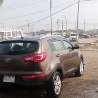 سبورتج موديل 2012 وارد أمريكي للبيع حادثها دعامية أمامية فقط بيها بارد...
