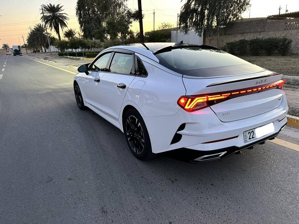 Kia K5 -Gt Line 2023 
وارد امريكي
فول موصفات
بنوراما
تشغيل عن بعد
محرك 1600تيربو
توقف ذاتي
رادارات امامي وخلفي وجانبي 
5 وضعيات قياده
دخول ذكي
مثبت سرعة 
شاشة كبيرة 
شحن لاسلكي 
هند بريك كهربائي 
بصمة
اشاير بلمري 
كامرة دواره 
اوتو هولد 
ترحيب بل اليدات
كشنات كهرباء وتدفئه
ماشيه 26 الف ميل
رقم اربيل باسمي

 حادثها فقط قطعه واحده باب الصدر مبدل بدون ايرباك 

مكاني بغداد الهاتف/*********** السعر 185وبيها مجال بسيط
