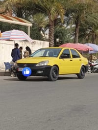 لانسر 2010 للبيع  مكينه 2000 كير حداديه تايرات تبريد كامله مكمله بغداد...