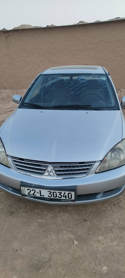 لانسر 2005 محرك 1300 رقم اربيل بيها قطعتين صبغ سعر 67 وبيها مجال مكان نينوئ رقم ***********
