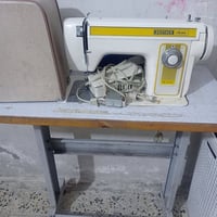 مكينة خياطة • شغالة • مع حافظة