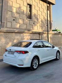 تويوتا كورلا هايبرد 2024  العلامة الزركة باب اول  ماشية 35 الف فقط الس...